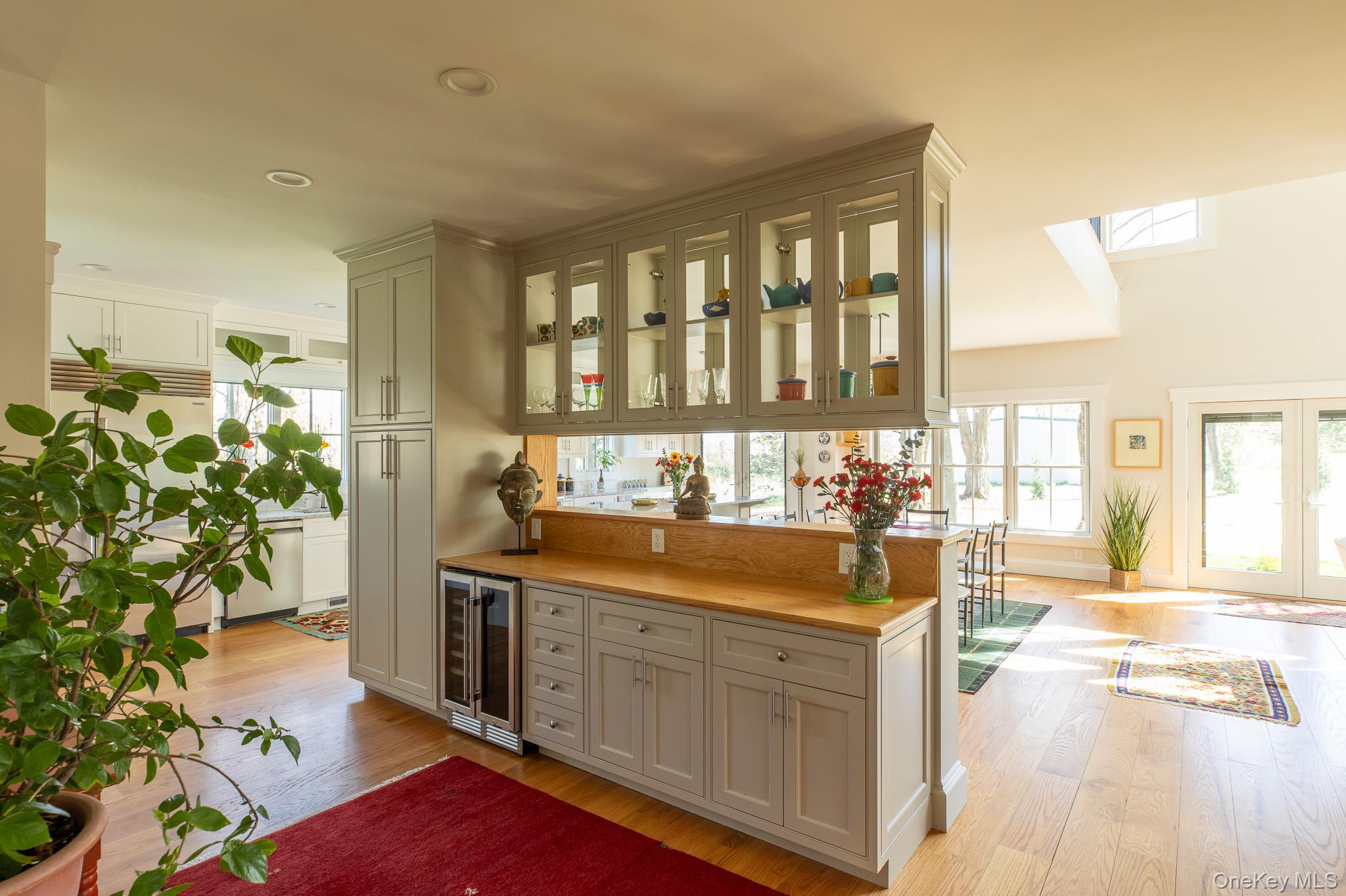 397 Viewmont Road Germantown, NY 12526 - Photo 10 of 47 Wet bar with beverage fridge and glass cabinets