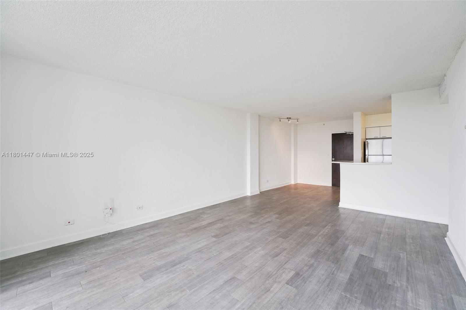 1500 Bay Road, Unit S0380 Miami Beach, FL 33139 - Photo 17 of 83 a view of empty room with wooden floor and window