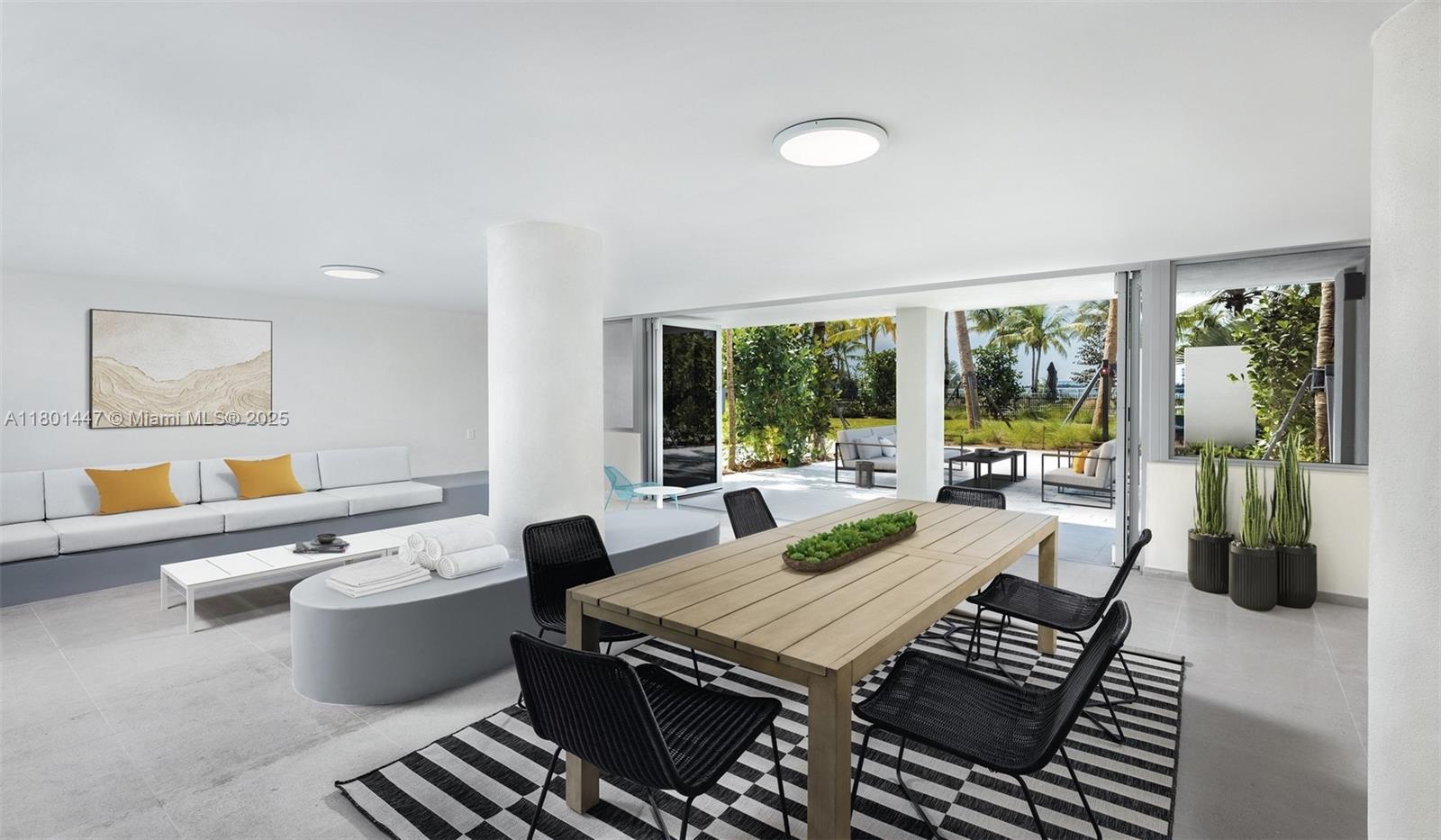 1500 Bay Road, Unit S0380 Miami Beach, FL 33139 - Photo 30 of 83 a living room with furniture a rug potted plant and a large window