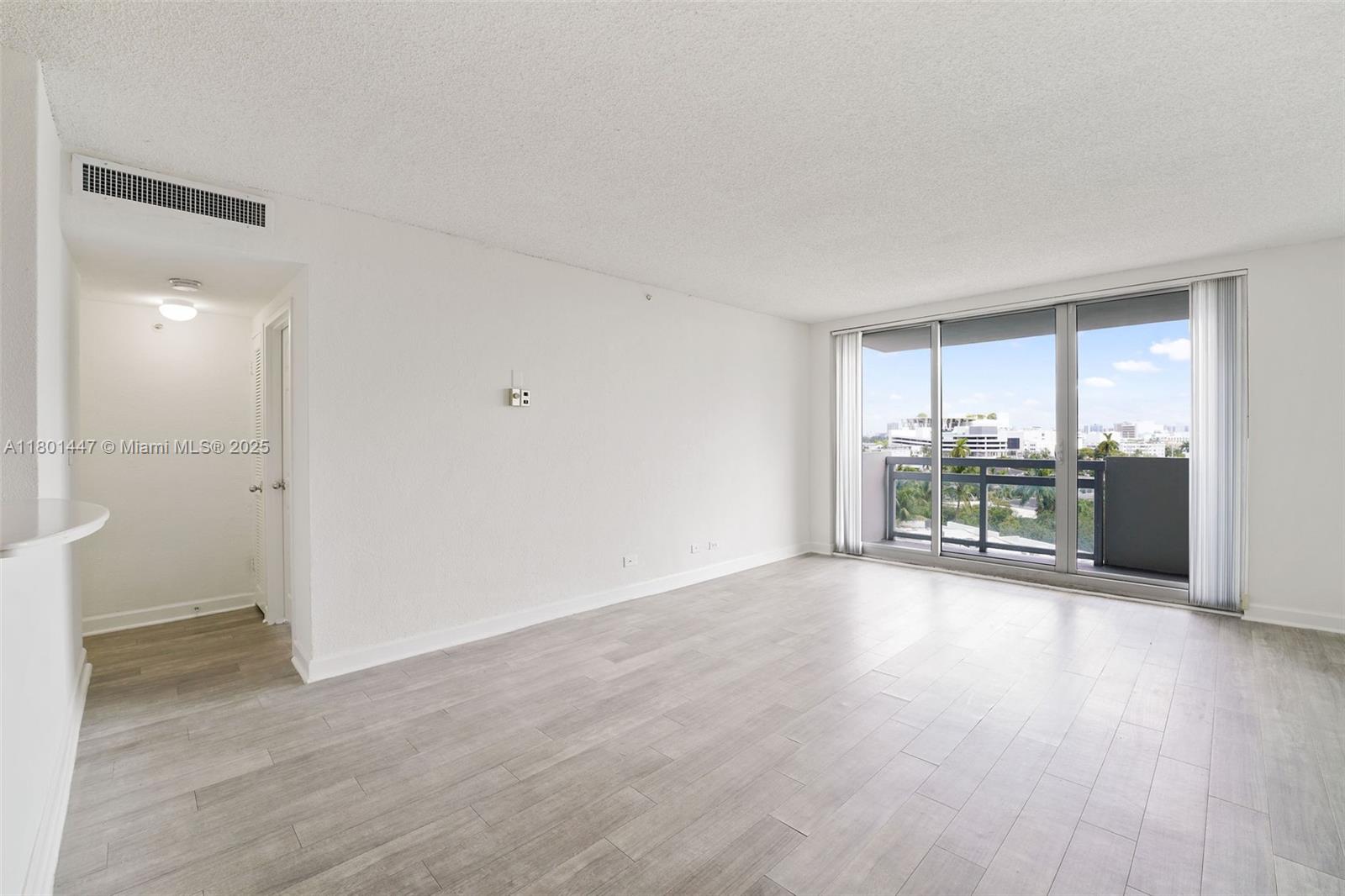 1500 Bay Road, Unit S0380 Miami Beach, FL 33139 - Photo 9 of 83 a view of a livingroom with wooden floor