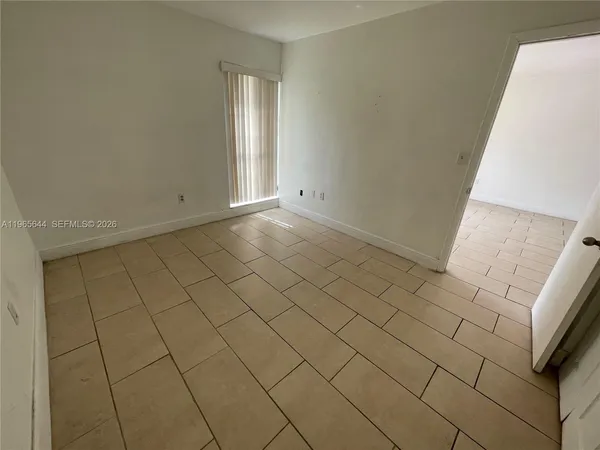 a view of an empty room and window