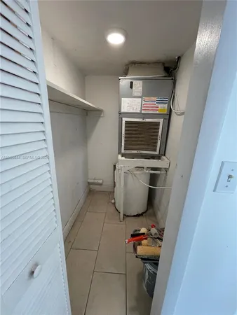 a bathroom with a sink a toilet a mirror and shower
