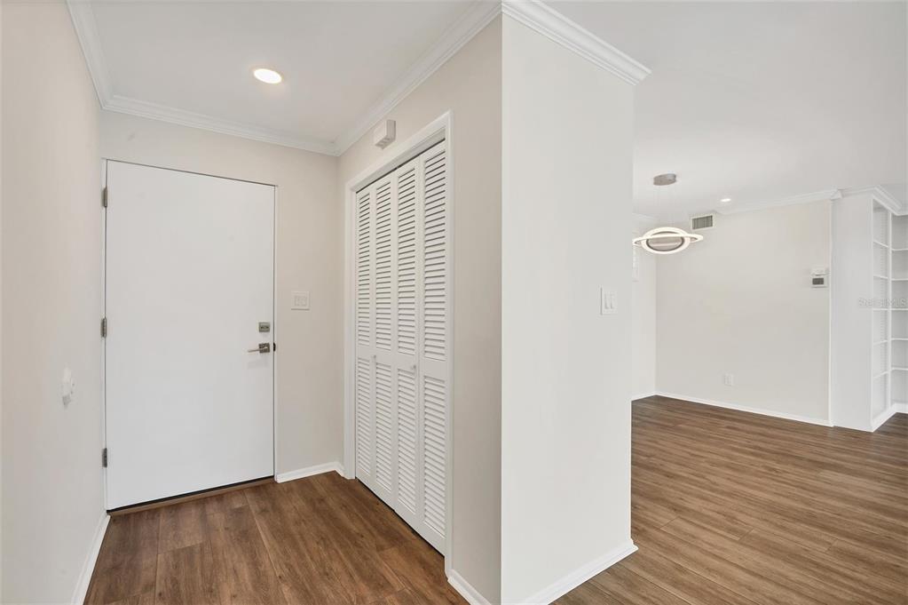 226 Golden Gate Point, Unit 32 Sarasota, FL 34236 - Photo 12 of 60 a view of hallway with wooden floor