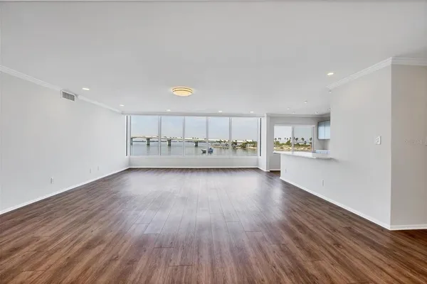 a view of kitchen with stainless steel appliances refrigerator stove microwave and cabinets