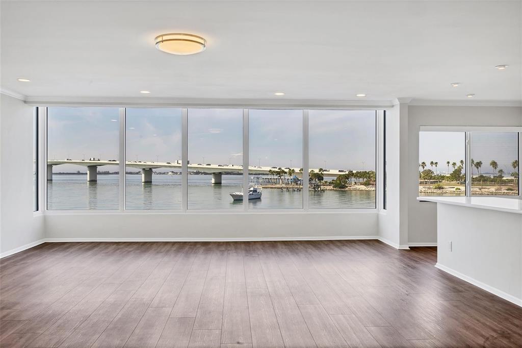 226 Golden Gate Point, Unit 32 Sarasota, FL 34236 - Photo 18 of 60 a view of a room with kitchen island and wooden floor