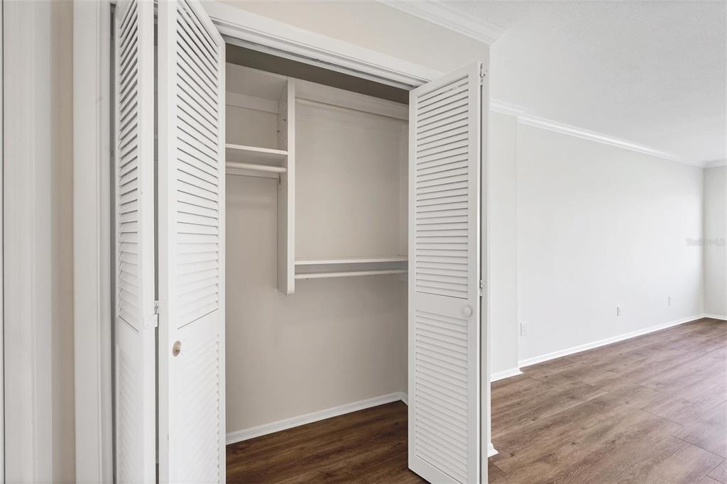226 Golden Gate Point, Unit 32 Sarasota, FL 34236 - Photo 29 of 60 a view of a hallway with wooden floor
