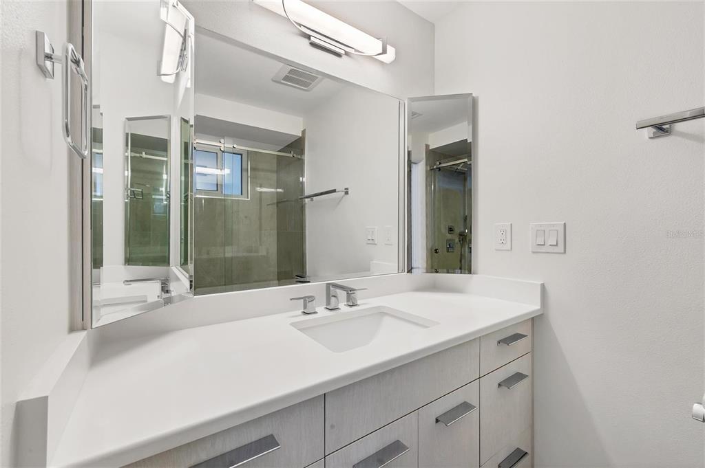 226 Golden Gate Point, Unit 32 Sarasota, FL 34236 - Photo 31 of 60 a bathroom with a sink and a mirror