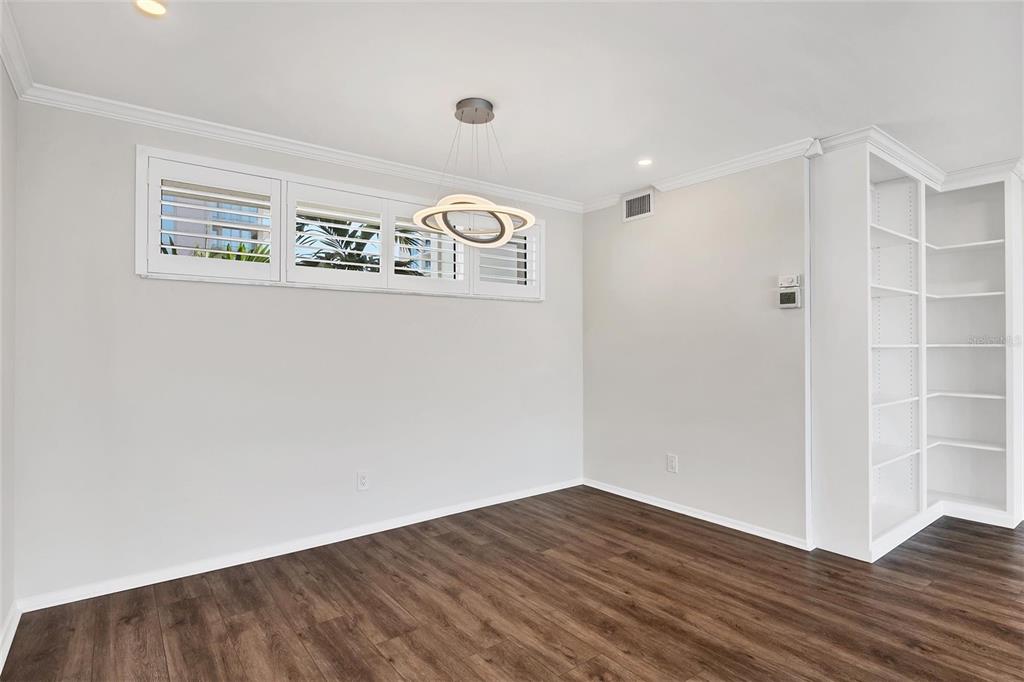 226 Golden Gate Point, Unit 32 Sarasota, FL 34236 - Photo 35 of 60 a view of an empty room with wooden floor