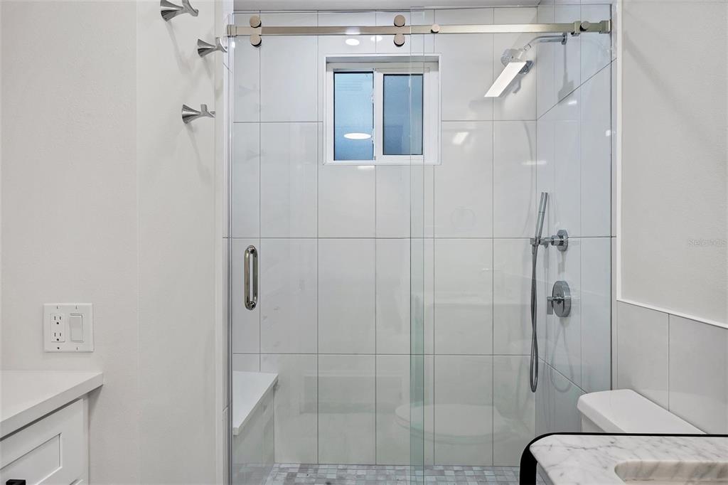 226 Golden Gate Point, Unit 32 Sarasota, FL 34236 - Photo 38 of 60 a bathroom with a shower