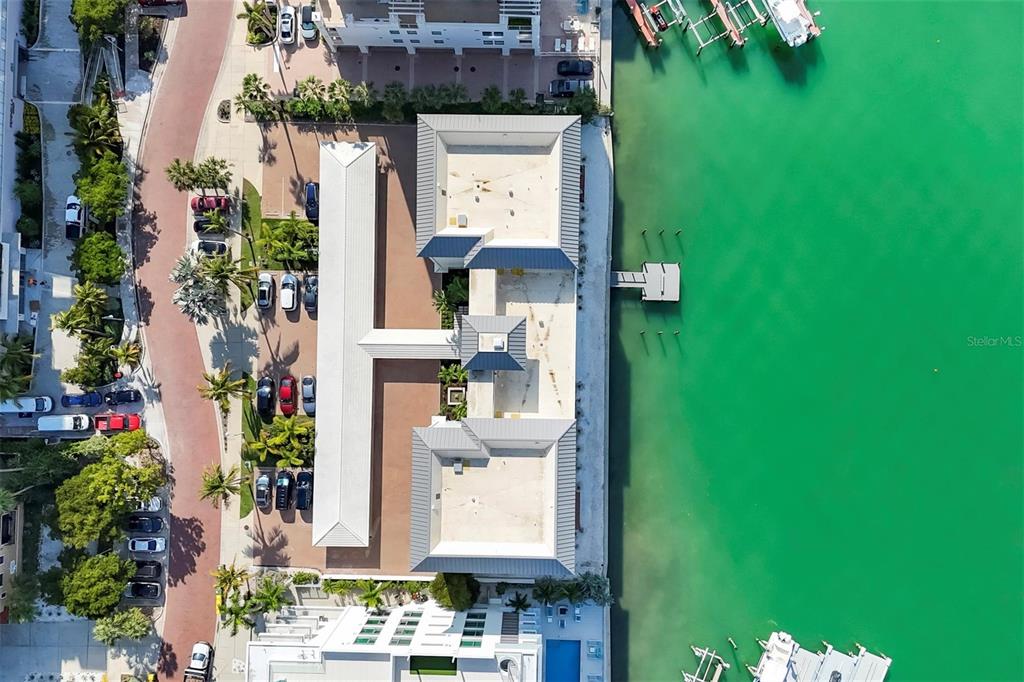226 Golden Gate Point, Unit 32 Sarasota, FL 34236 - Photo 46 of 60 an aerial view of residential houses with outdoor space and parking