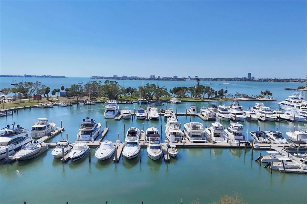 226 Golden Gate Point, Unit 32 Sarasota, FL 34236 - Photo 54 of 60 a view of a lake with boats and trees in the background