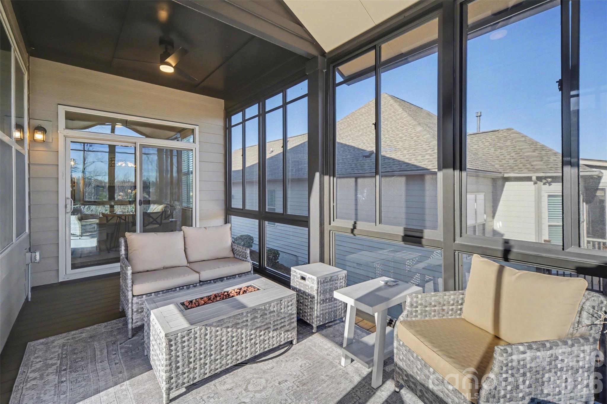 15828 Vale Ridge Drive Charlotte, NC 28278 - Photo 18 of 33 a living room with furniture and a floor to ceiling window
