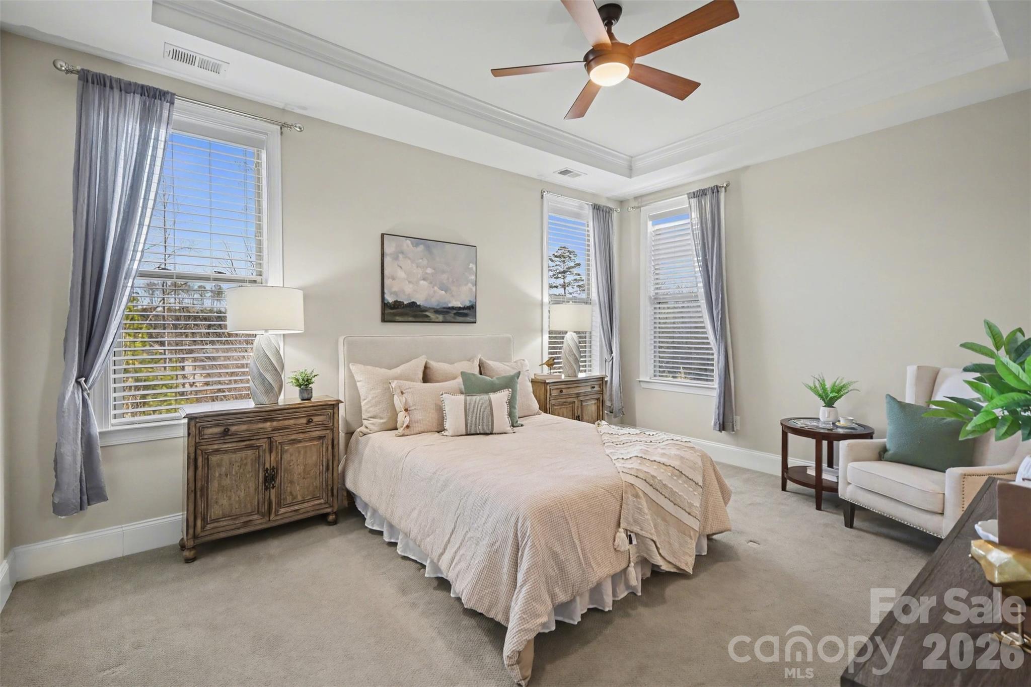 15828 Vale Ridge Drive Charlotte, NC 28278 - Photo 19 of 33 a bedroom with a bed and ceiling fan