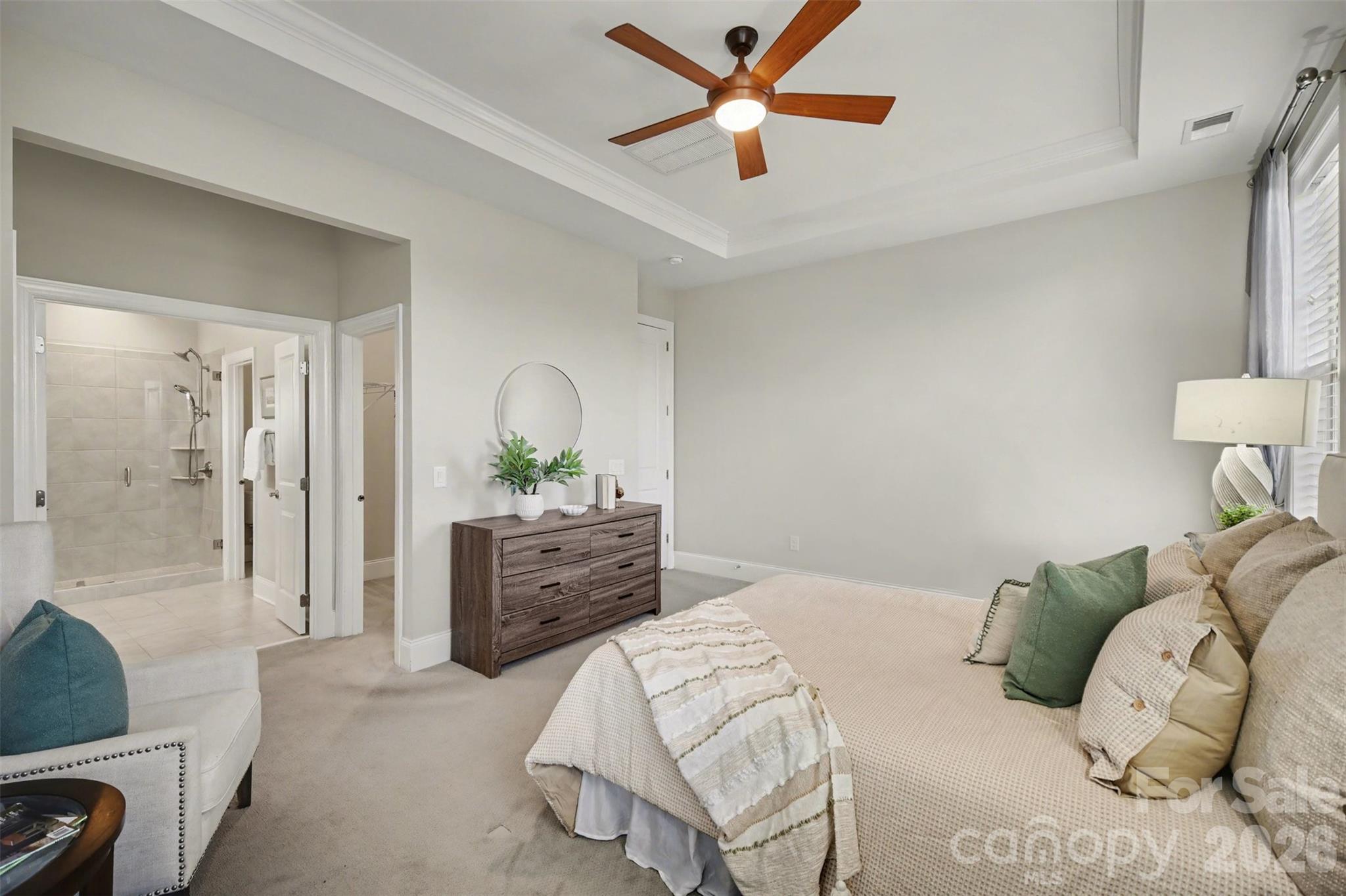 15828 Vale Ridge Drive Charlotte, NC 28278 - Photo 20 of 33 a bedroom with a bed and a chandelier