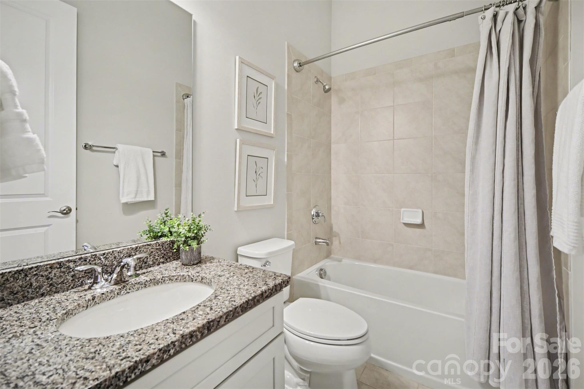 15828 Vale Ridge Drive Charlotte, NC 28278 - Photo 25 of 33 a bathroom with a granite countertop sink toilet and shower