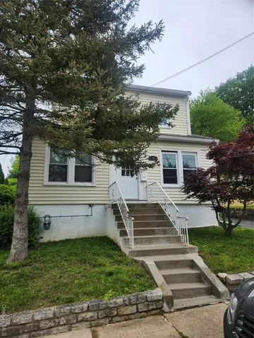 a view of house with yard