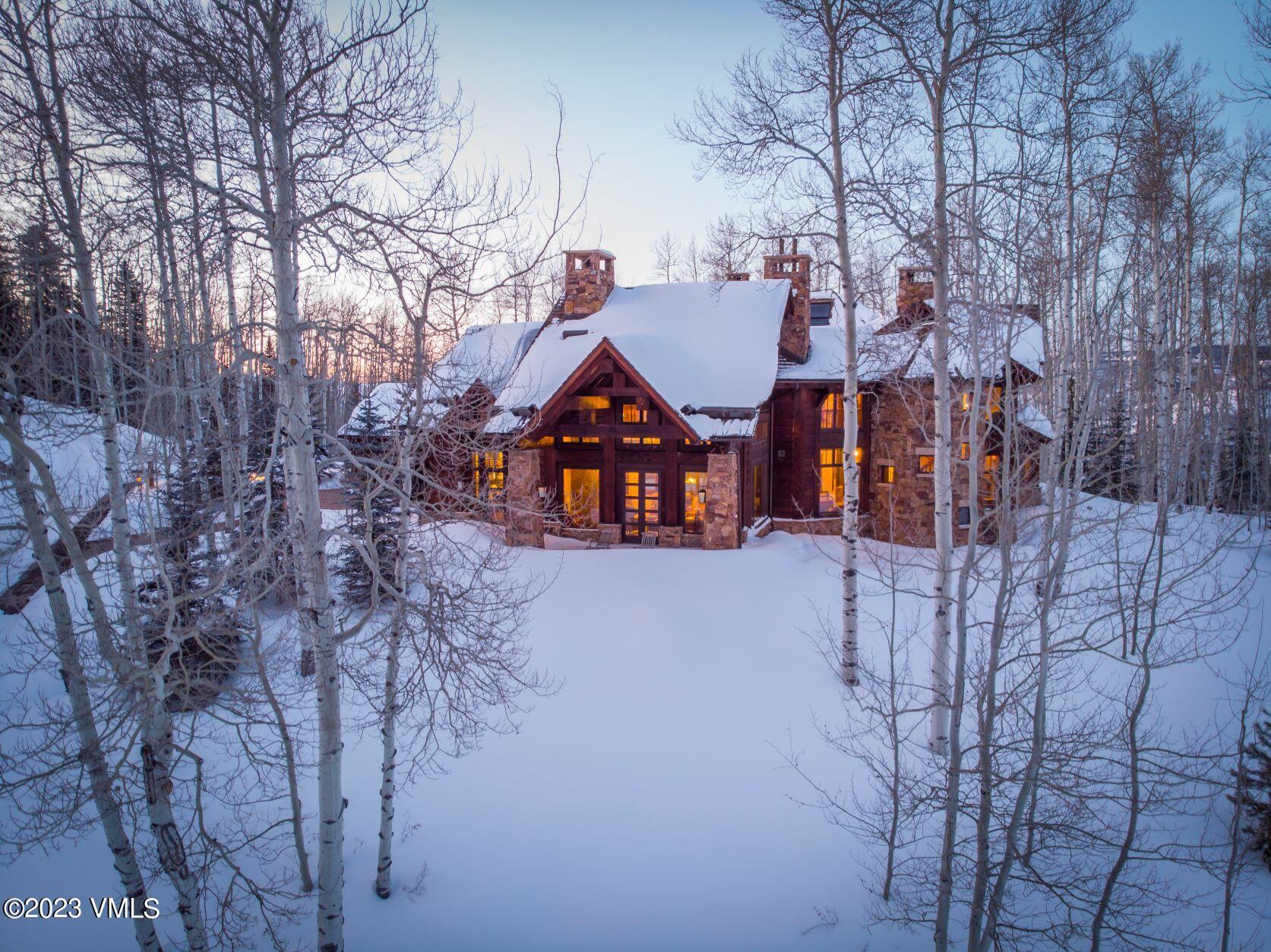 3546 Daybreak Ridge Road Avon, CO 81620 - Photo 17 of 19 a view of house with a yard