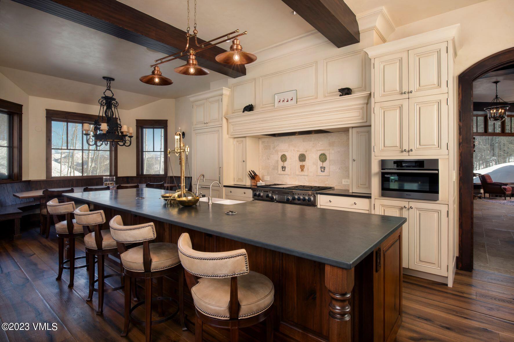 3546 Daybreak Ridge Road Avon, CO 81620 - Photo 9 of 19 a kitchen with a table and chairs in it