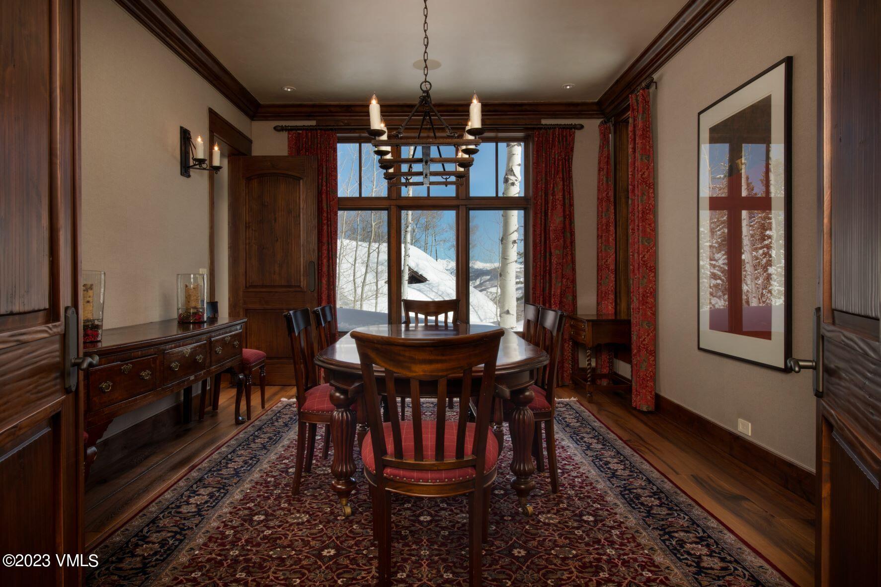 3546 Daybreak Ridge Road Avon, CO 81620 - Photo 10 of 19 a view of a dining room with furniture window and wooden floor