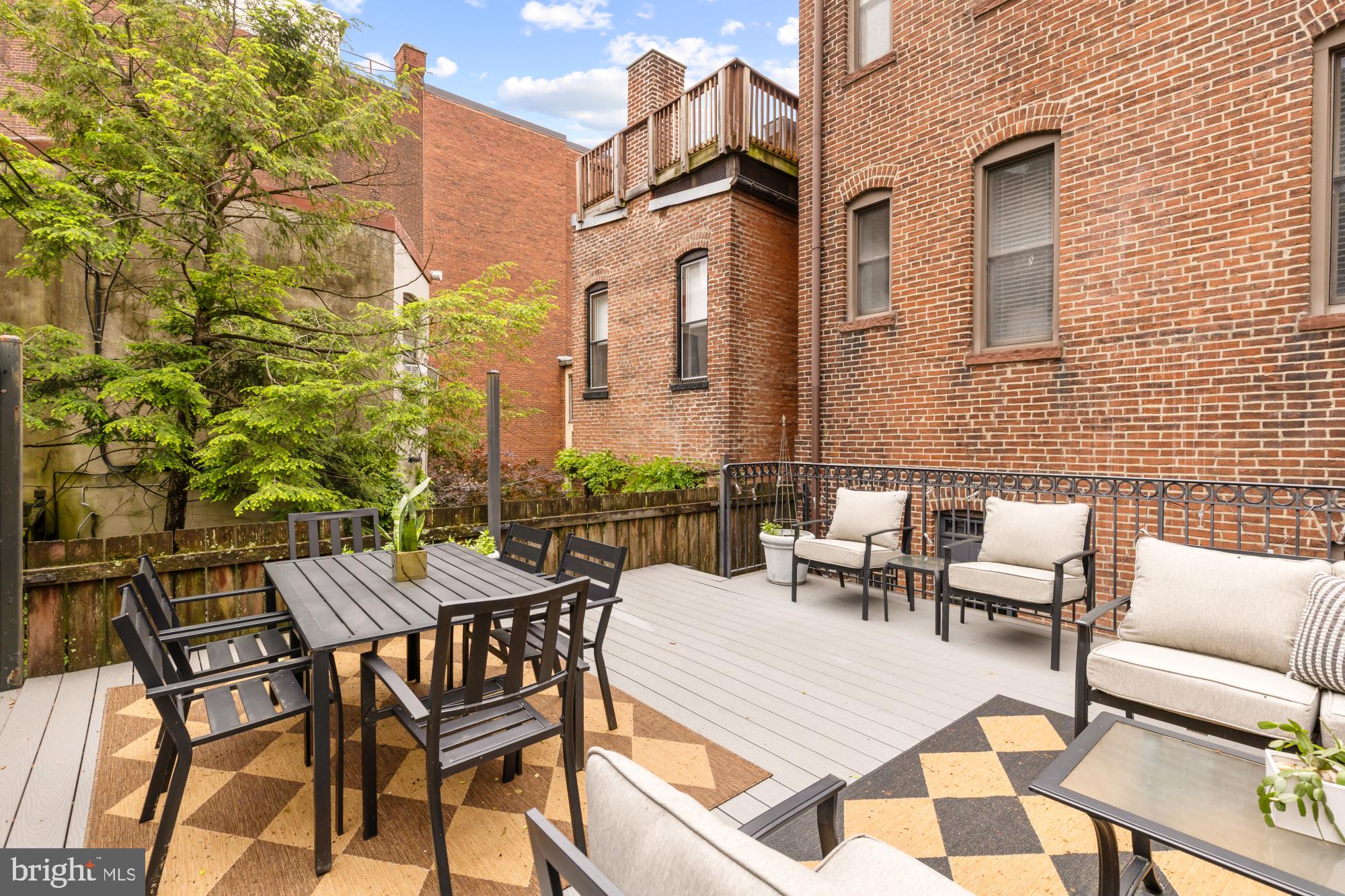 a view of a patio with a table and chairs