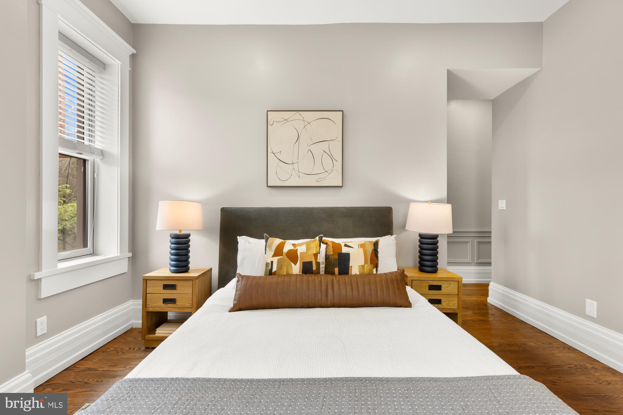 1519 Kingman Place Northwest Washington, DC 20005 - Photo 11 of 25 a bedroom with a bed and wooden floor