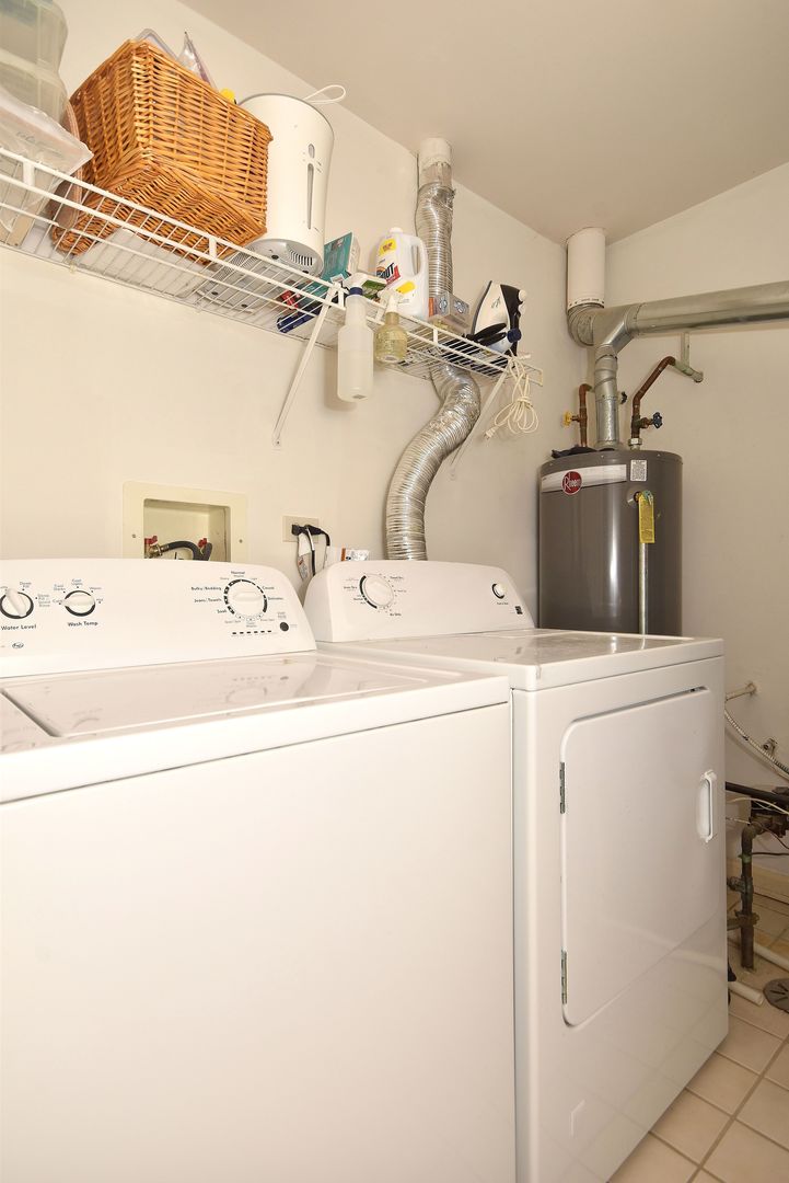 8205 Ripple Ridge Darien, IL 60561 - Photo 20 of 22 a utility room with dryer and washer