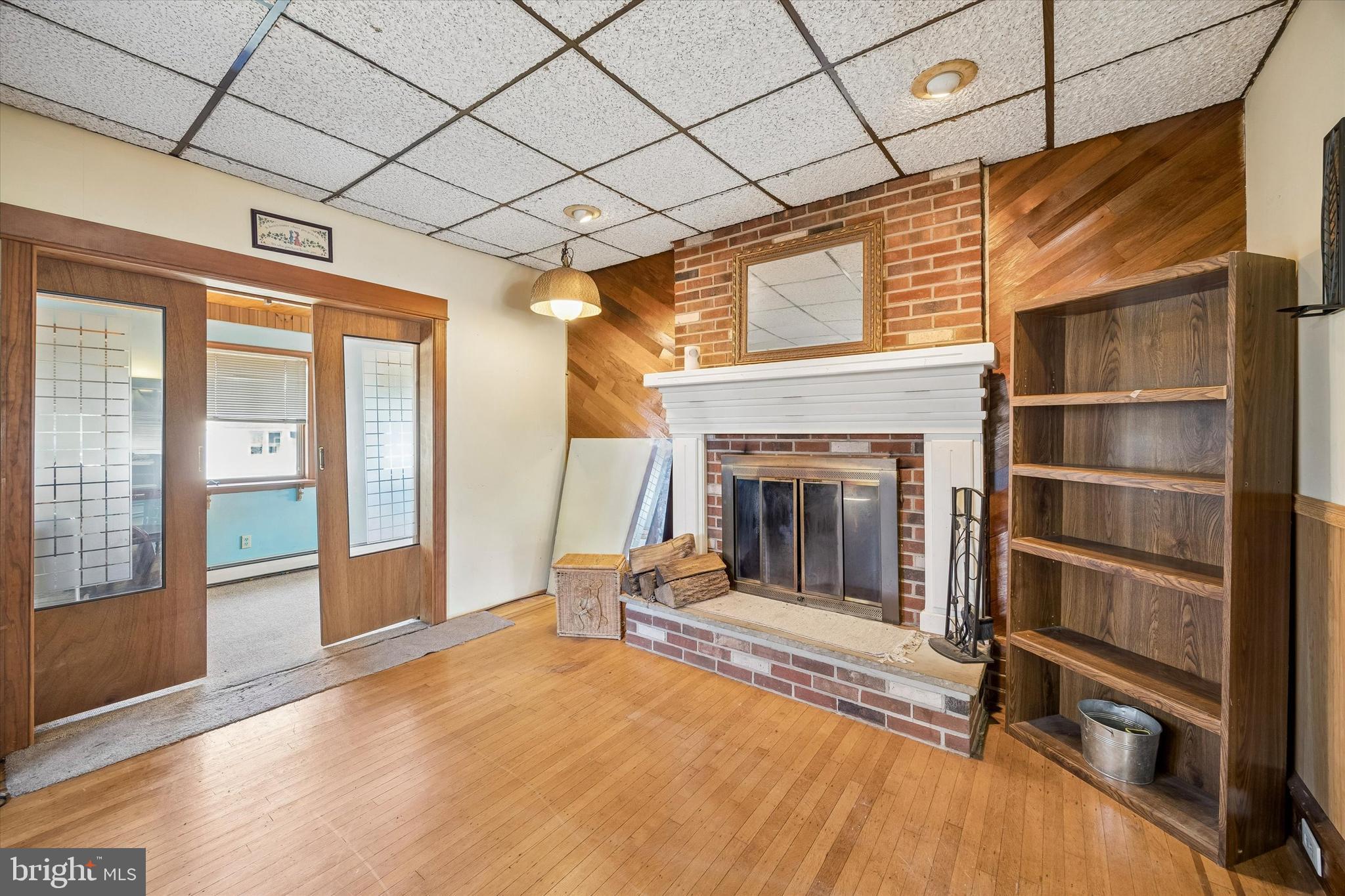 620 Gilbert Road Ridley Park, PA 19078 - Photo 6 of 35 a view of an empty room with wooden floor and a fireplace