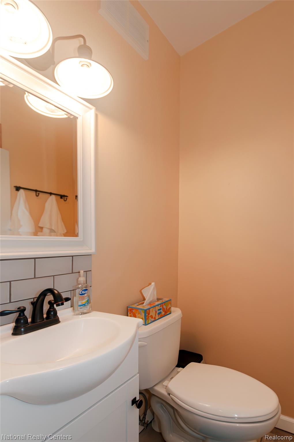 2446 Milverton Road Troy, MI 48083 - Photo 24 of 41 Bathroom featuring vanity and backsplash
