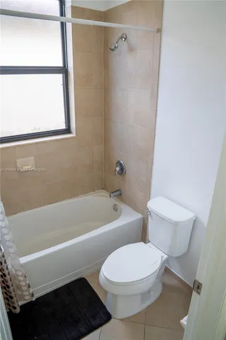 a bathroom with a toilet a sink and a bathtub