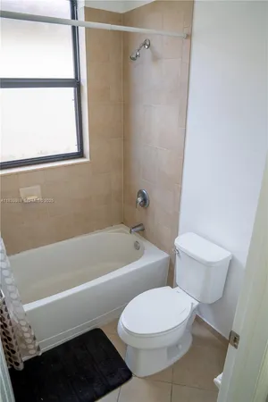 a view of a room with wooden floor sink and closet