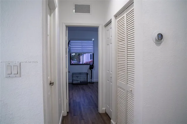 a view of a room with wooden floor sink and closet