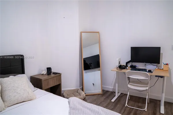 a bathroom with a sink toilet and mirror