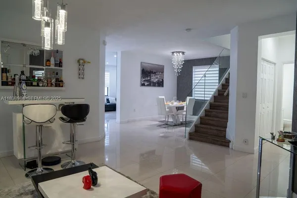 a kitchen with sink refrigerator and window