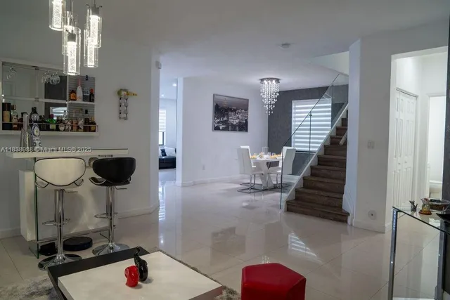 a kitchen with sink refrigerator and window