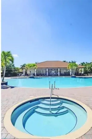 a view of outdoor space with a swimming pool