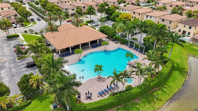 an aerial view of a house a yard and outdoor seating