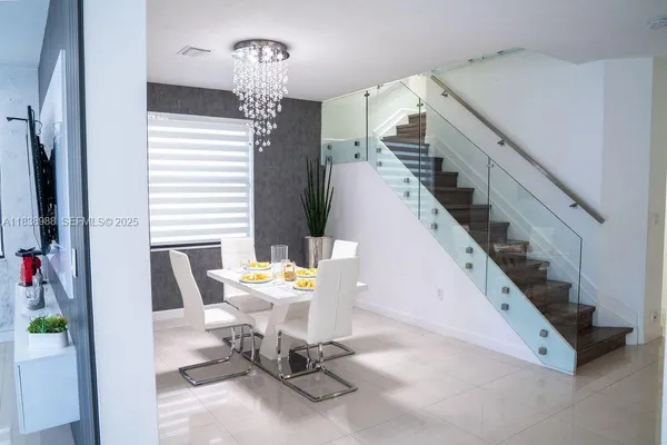 a view of hall way with furniture and stairs