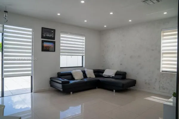 a living room with furniture and a window