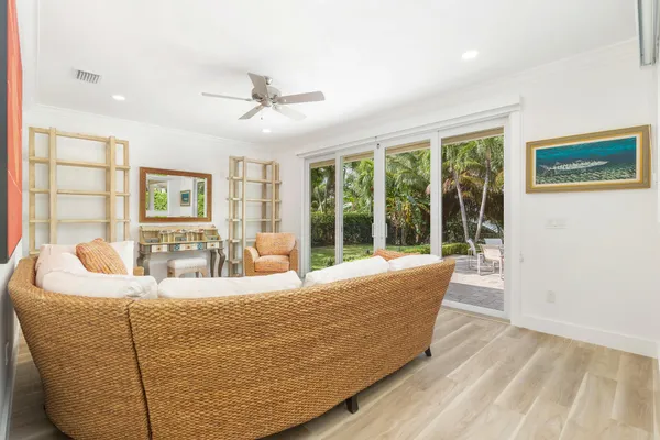 a living room with furniture and large window