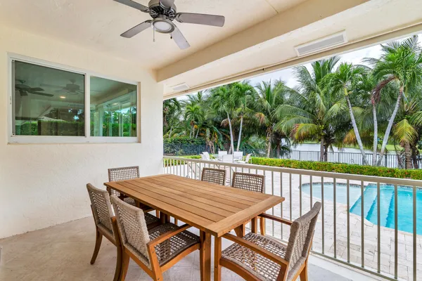 a view of a patio with a table and chairs