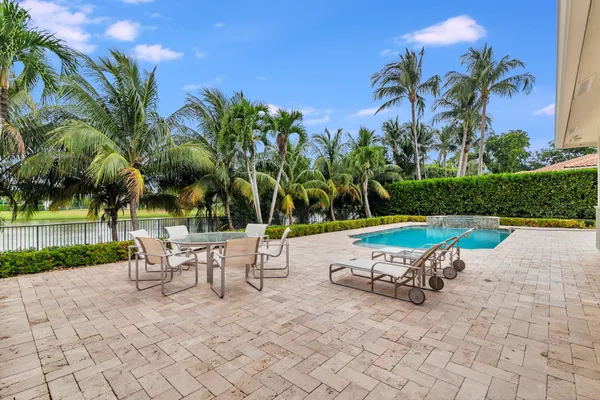 a view of a backyard with a sitting area