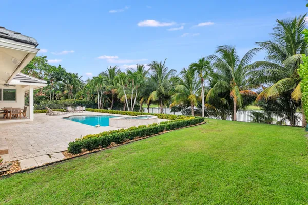 a view of a swimming pool and a yard