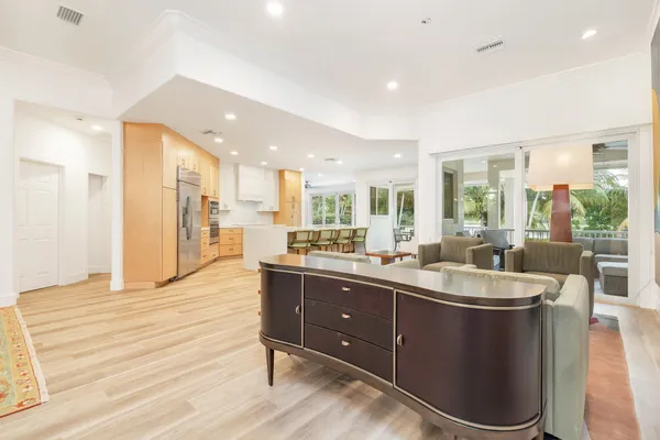 a kitchen with sink and refrigerator