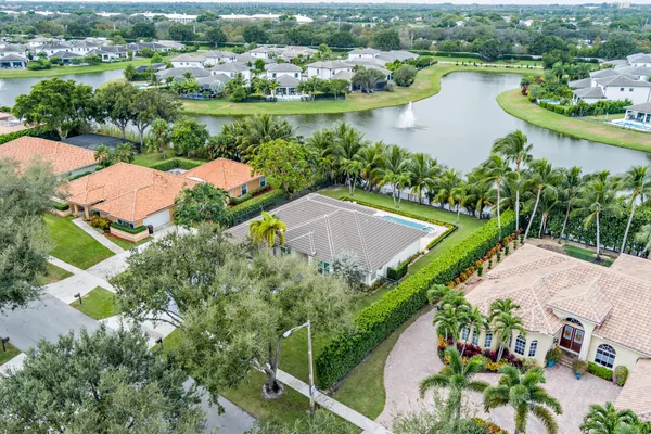 an aerial view of a house with a lake view