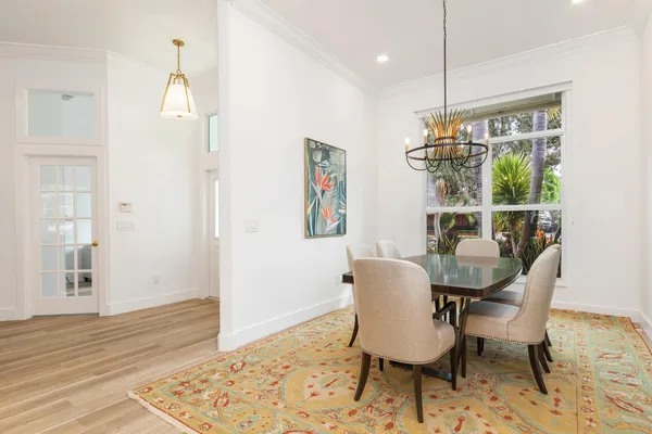a view of a dining room with furniture window and wooden floor