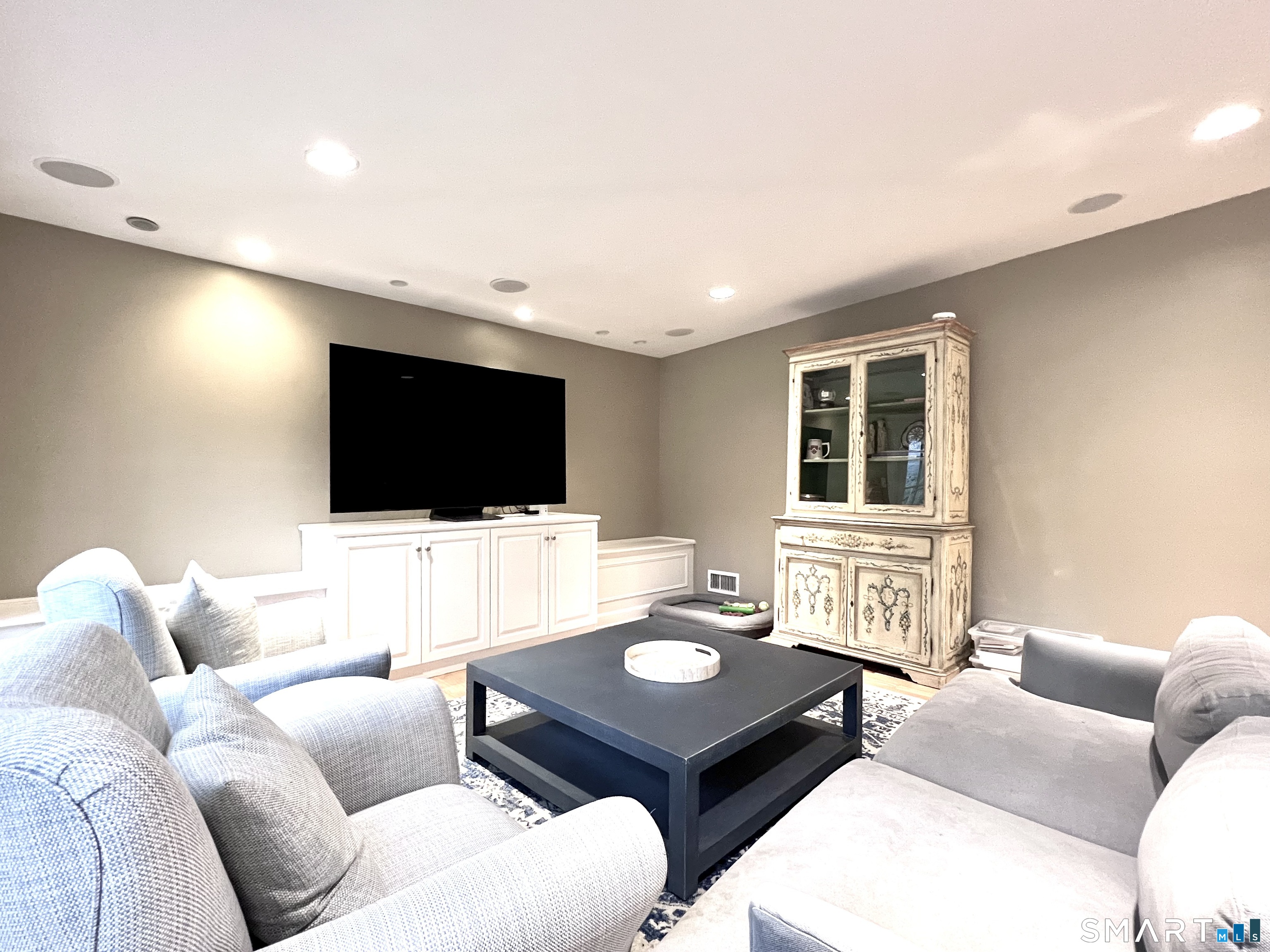 14 Laforge Road Darien, CT 06820 - Photo 11 of 35 a living room with furniture and a flat screen tv