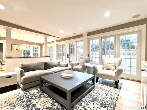a living room with furniture and a rug