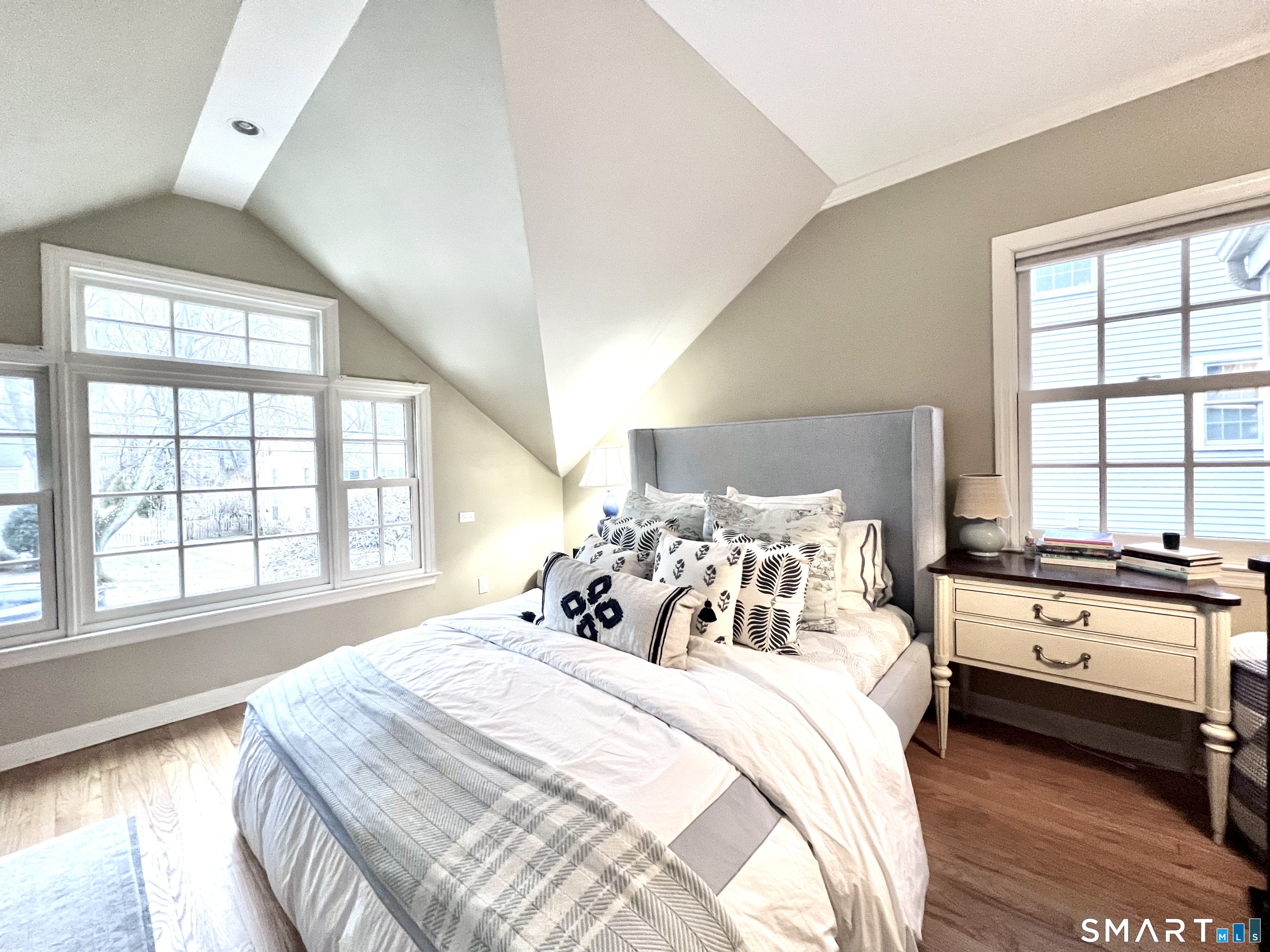 14 Laforge Road Darien, CT 06820 - Photo 19 of 35 a bedroom with a bed and a large window