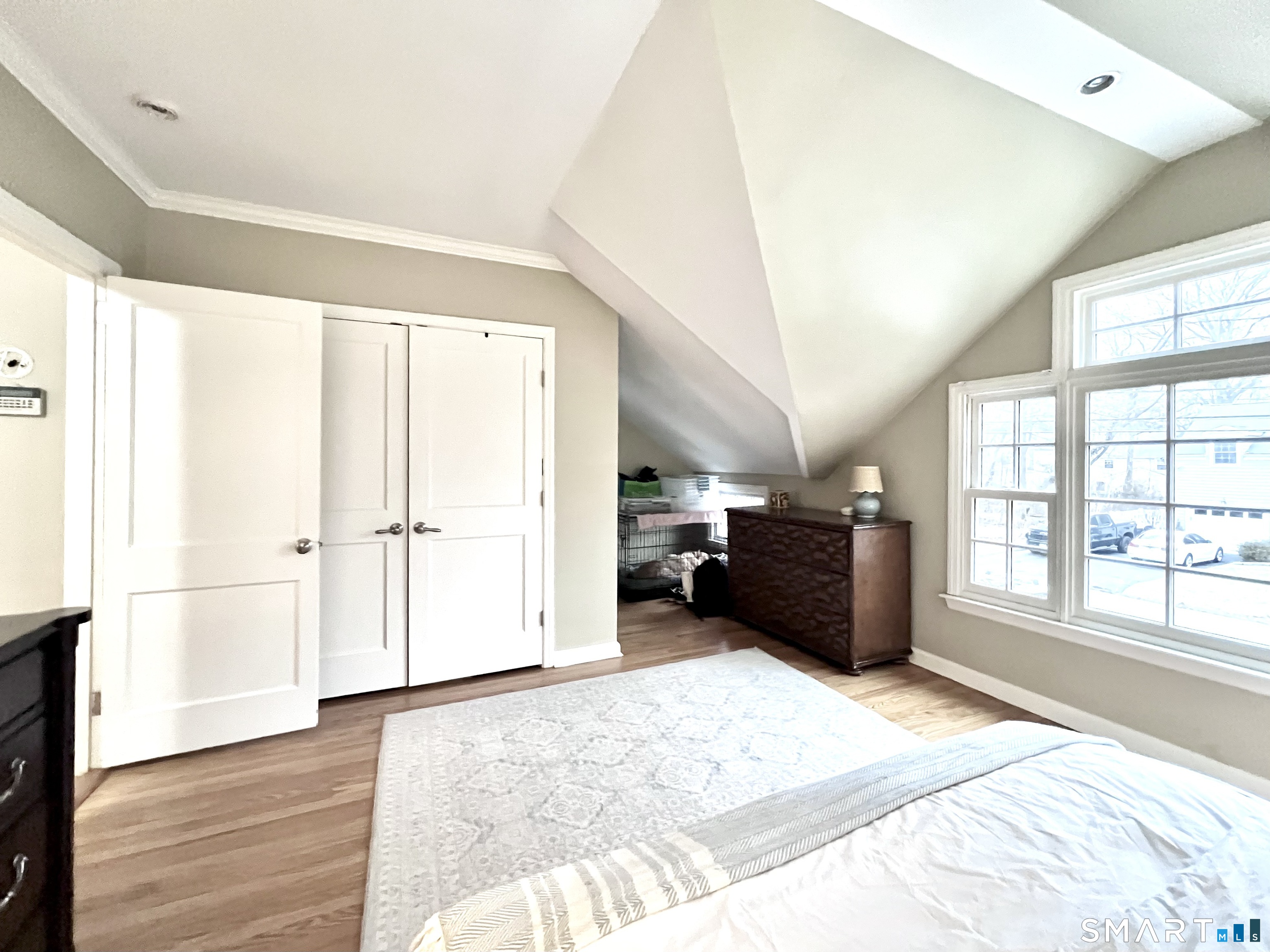 14 Laforge Road Darien, CT 06820 - Photo 22 of 35 a spacious bedroom with a bed and a large window