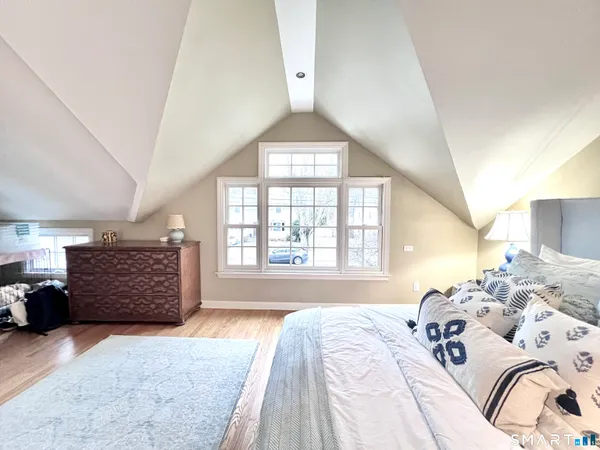 a bed room with a bed and a window